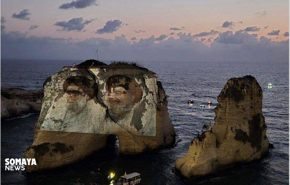 حزب الله يكسر قرار الحكومة بإضاءة صخرة الروشة بصور نصرالله وصفي الدين